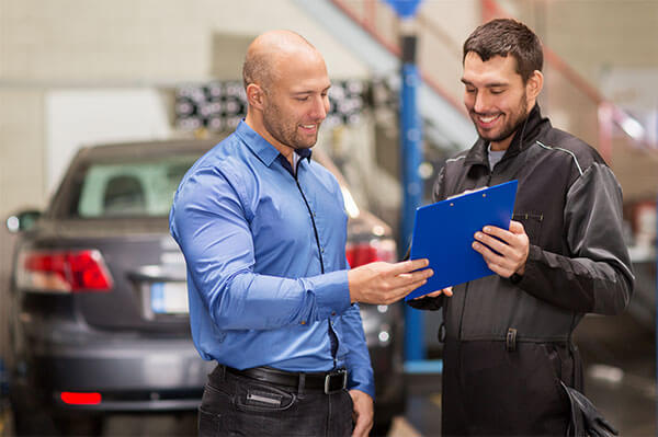 car mechanic with customer